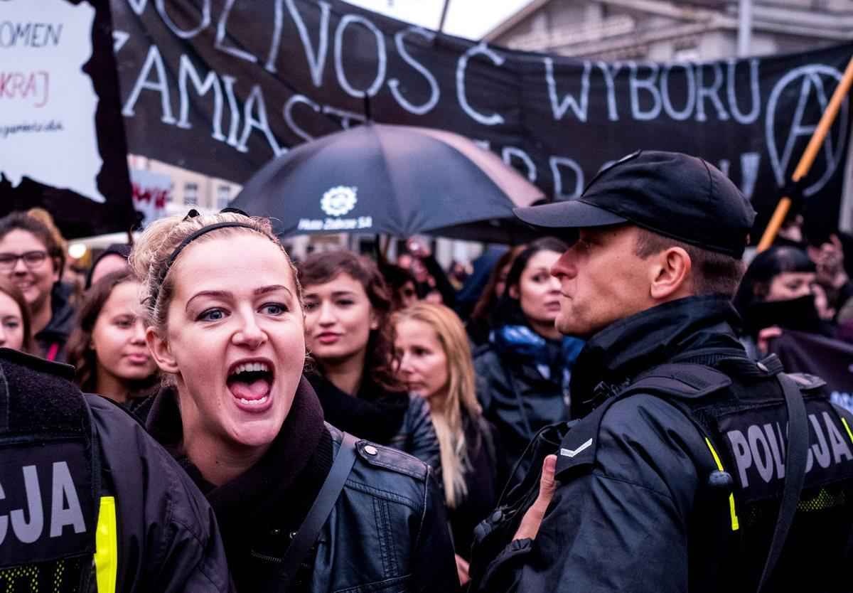 epa05568708 Protesters gather on the streets during the nationwide women strike in Katowice, Poland, 03 October 2016. Despite the heavy rains thousands of women and men protested to express their opposition to strengthen the regulations on the abortion law. Black-clad opponents of government plans to ban abortion staged a 'Black Monday'. Thousands of women took a day off from work to express their solidarity and fight for the entitlement to legal abortion, sex education, contraception and in vitro conception.  EPA/Andrzej Grygiel POLAND OUT