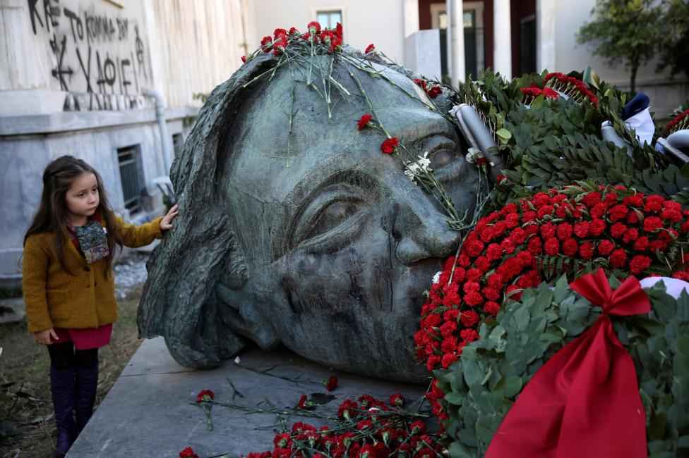 A girl stands next to a monument inside the Athens' Polytechnic school, on the 43rd anniversary of a 1973 student uprising against the then military ruling junta in Athens, Greece. REUTERS/Alkis Konstantinidis