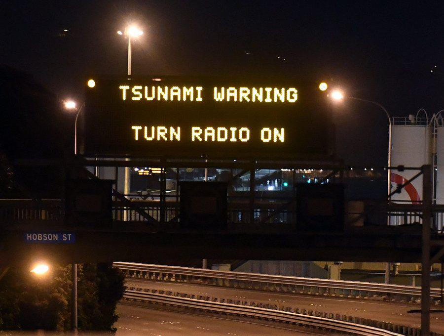 epa05630021 A motorway sign warning of a possible tsunami after an earthquake based around Cheviot in the South island hit the capital Wellington, New Zealand, early 14 November 2016. According to reports, a 7.8 magnitude earthqauke has hit New Zealand overnight, triggering a tsunami warning for the east coast of the country.  EPA/ROSS SETFORD